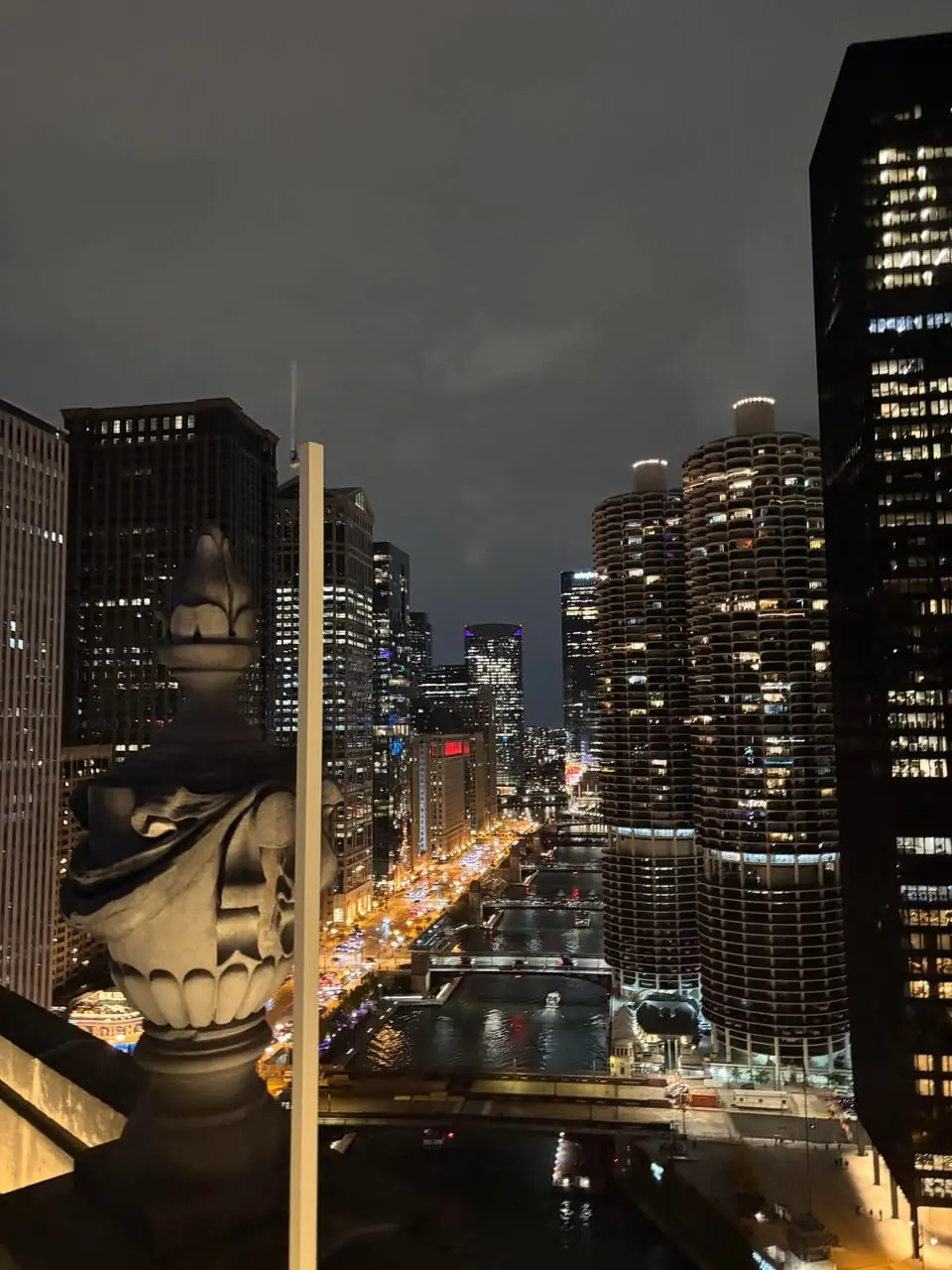 A night view over the Chicago River and River North from a high balcony