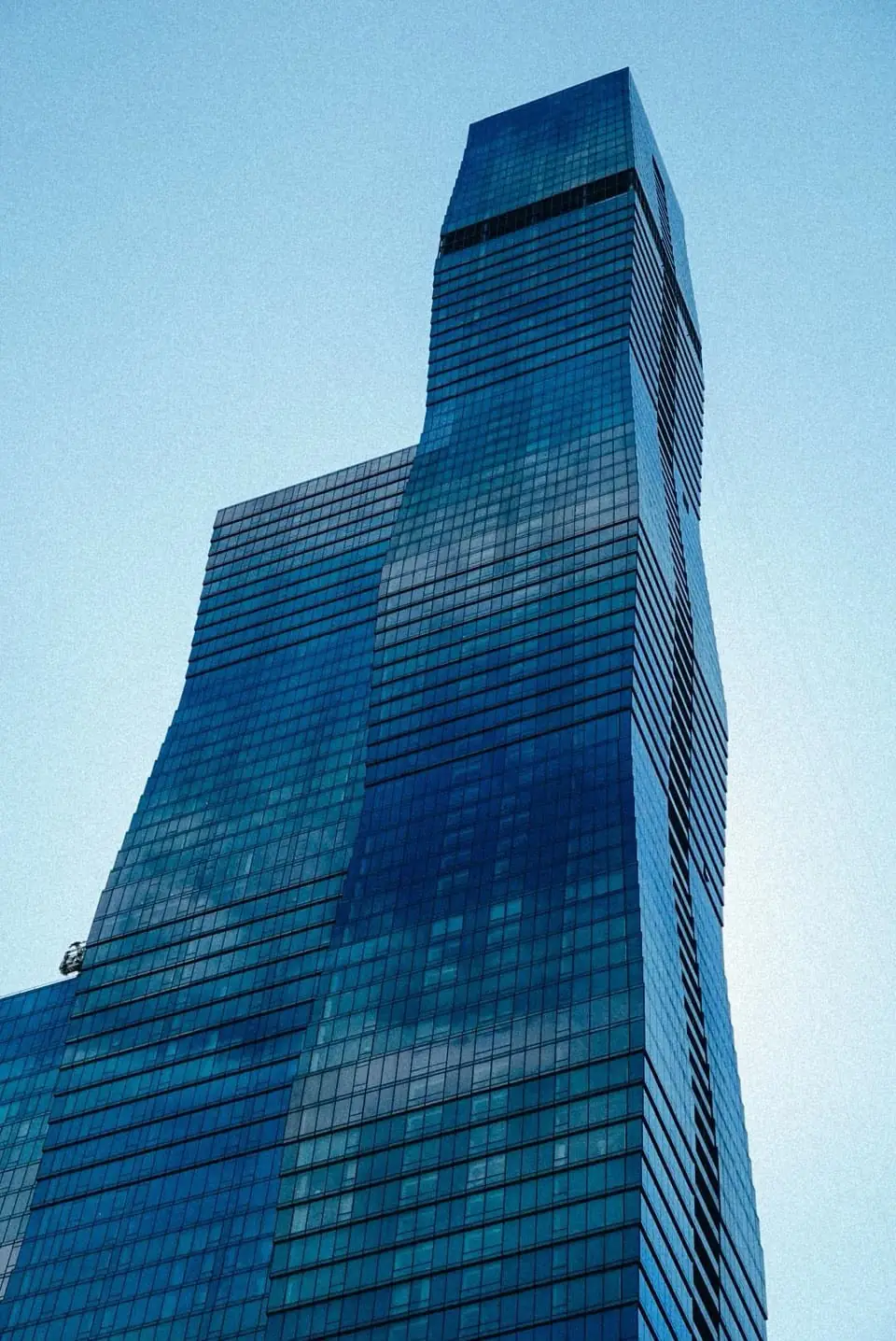 The blue glass St. Regis Chicago tower against the sky