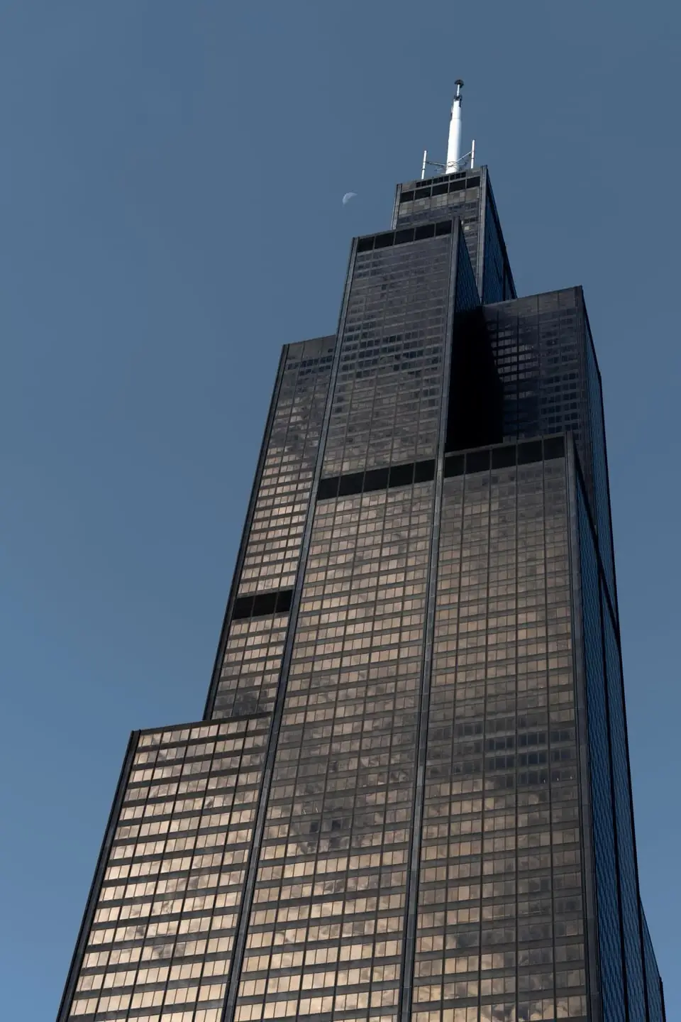 Willis Tower seen from below against a blue sky